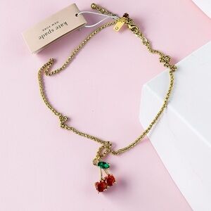 Kate Spade NWT cherry necklace with drawstring jewelry pouch
